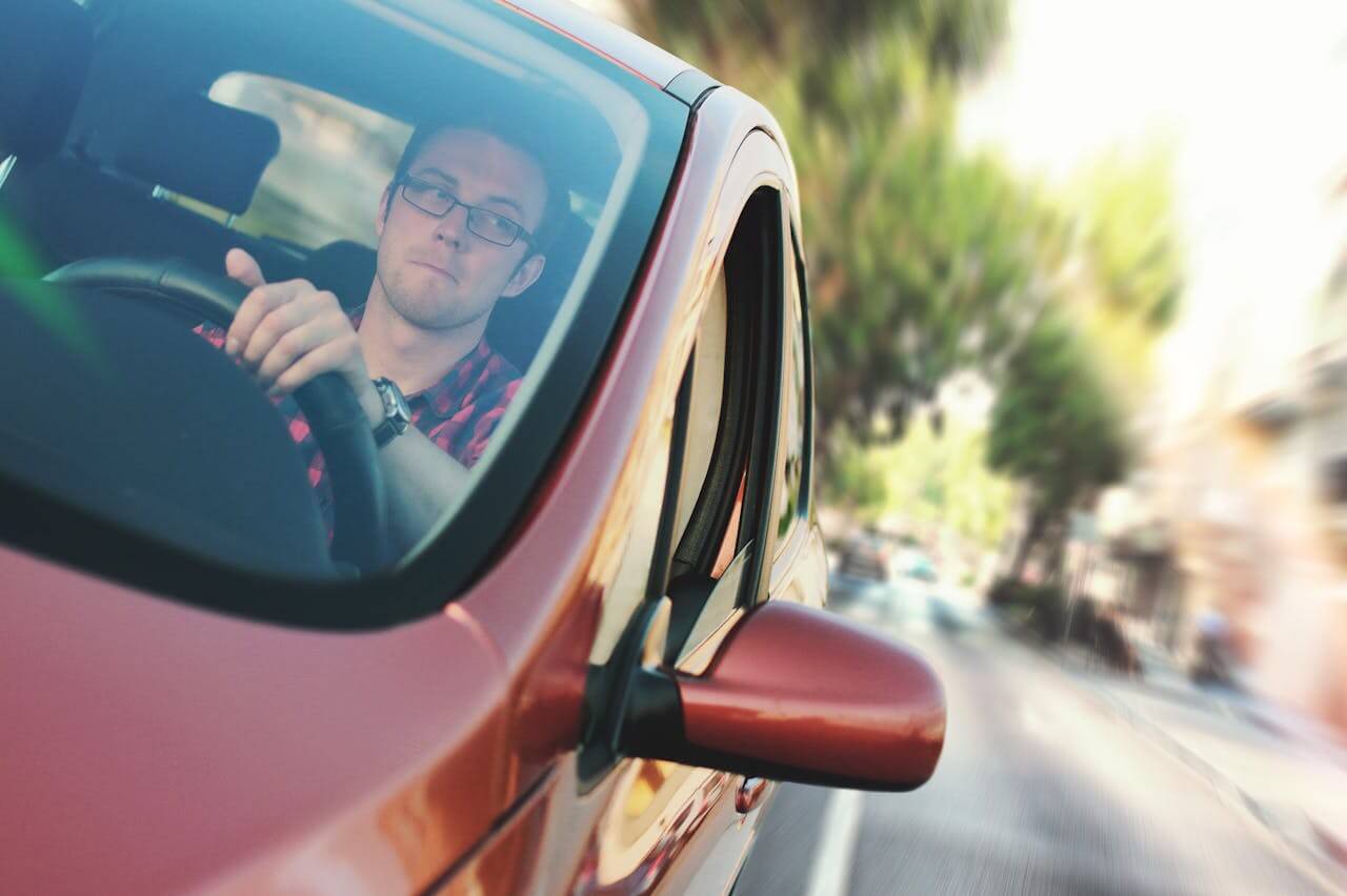 A man driving a car